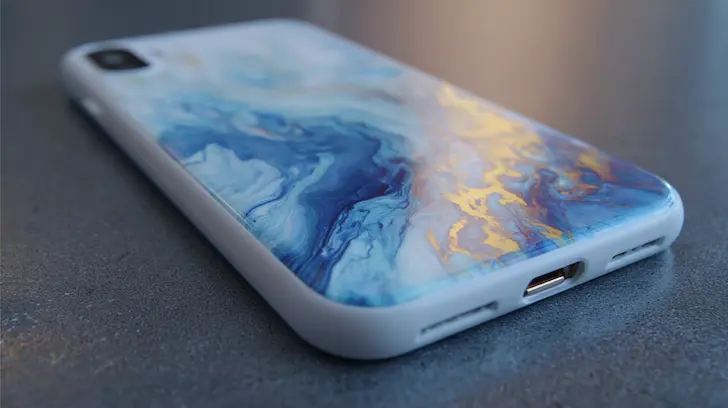 Visual of a phone case and wearable tech with graphics fused beneath a transparent polymer layer